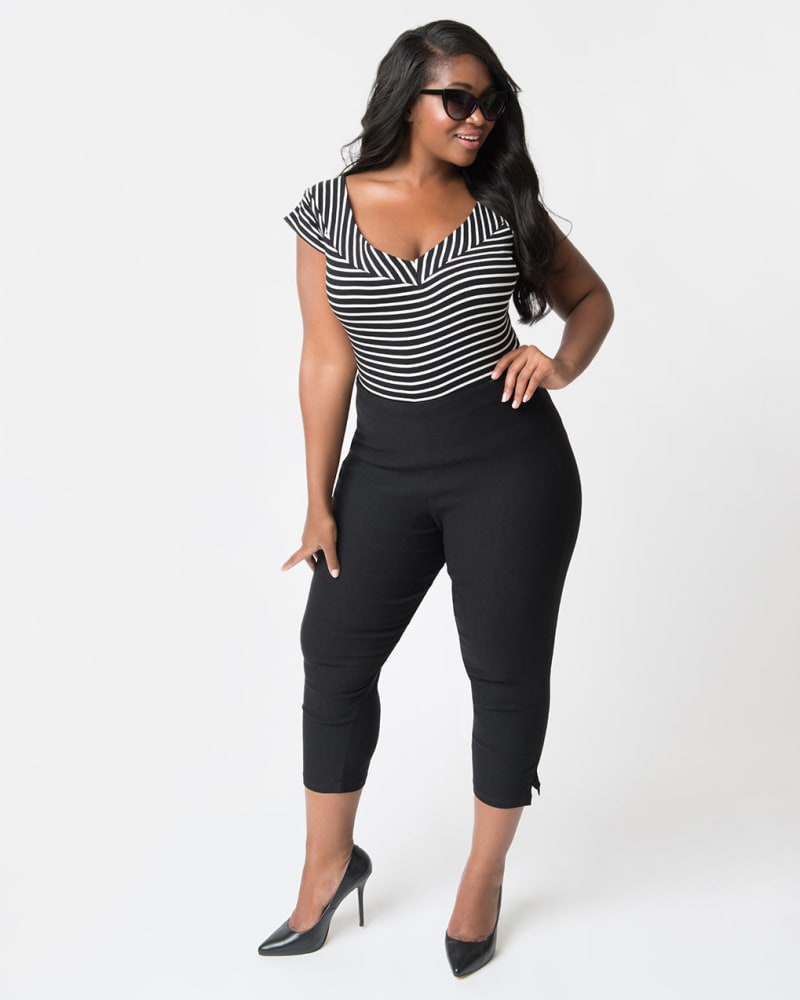 Front of a model wearing a size 2X Unique Vintage 1950s Black High Waist Rachelle Capri Pants in Black by Unique Vintage. | dia_product_style_image_id:288864